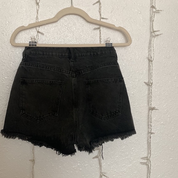 Mid rise distressed black shorts. - Picture 2 of 2